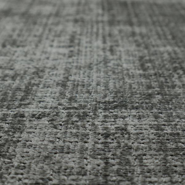 Scanno Weave upholstery fabric in a neutral grey shade, featuring a detailed, woven texture with an interlocking grid pattern.