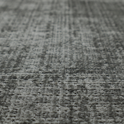 Scanno Weave upholstery fabric in a neutral grey shade, featuring a detailed, woven texture with an interlocking grid pattern.
