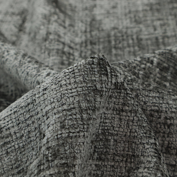 Scanno Weave upholstery fabric in a neutral grey shade, featuring a detailed, woven texture with an interlocking grid pattern.