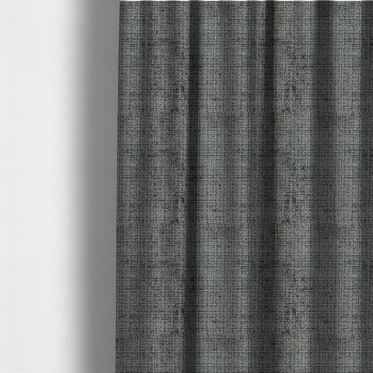 The fabric used to create these made-to-measure curtains is a Scanno Weave upholstery fabric in a neutral grey shade, featuring a detailed, woven texture with an interlocking grid pattern.