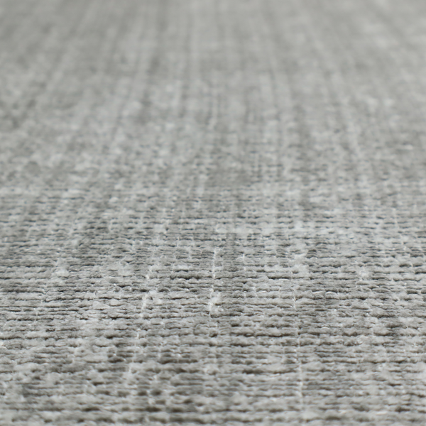 Scanno Weave upholstery fabric in a light grey shade, featuring a detailed, woven texture with an interlocking grid pattern.
