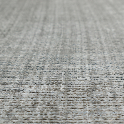 Scanno Weave upholstery fabric in a light grey shade, featuring a detailed, woven texture with an interlocking grid pattern.