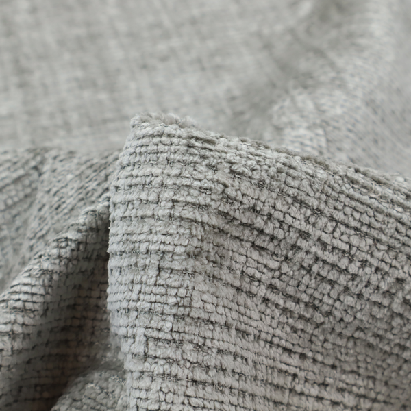 Scanno Weave upholstery fabric in a light grey shade, featuring a detailed, woven texture with an interlocking grid pattern.