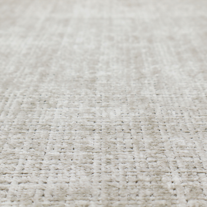 Scanno Weave upholstery fabric in a creamy off-white shade, featuring a detailed, woven texture with an interlocking grid pattern.