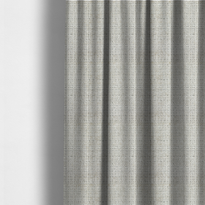 The fabric used to create these made-to-measure curtains is a Scanno Weave upholstery fabric in a creamy off-white shade, featuring a detailed, woven texture with an interlocking grid pattern.