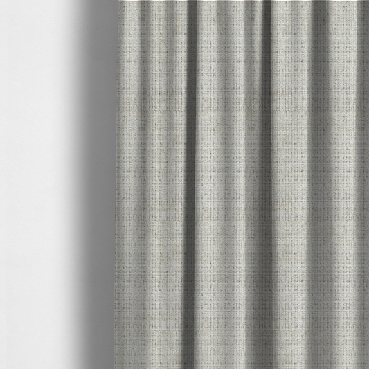 The fabric used to create these made-to-measure curtains is a Scanno Weave upholstery fabric in a creamy off-white shade, featuring a detailed, woven texture with an interlocking grid pattern.