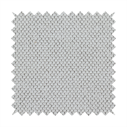 A waffle-knit or honeycomb-patterned weave characterized by a repeating, three-dimensional grid of soft, raised textures. Its off-white or light grey tone and uniform geometric structure suggest a cosy, high-quality material, commonly found in thermal apparel, heavy cotton blankets, or sophisticated upholstery. The dense, woven design provides a matte appearance with a subtle, visually rich depth.