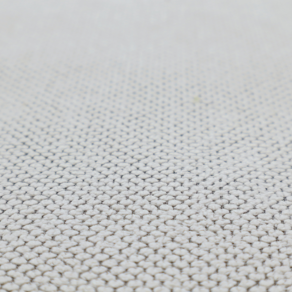 A waffle-knit or honeycomb-patterned weave characterized by a repeating, three-dimensional grid of soft, raised textures. Its off-white or light grey tone and uniform geometric structure suggest a cosy, high-quality material, commonly found in thermal apparel, heavy cotton blankets, or sophisticated upholstery. The dense, woven design provides a matte appearance with a subtle, visually rich depth.