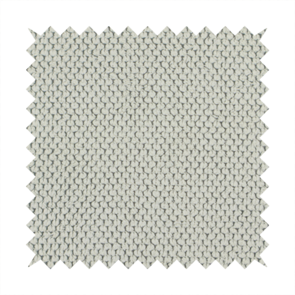 A waffle-knit or honeycomb-patterned weave, defined by a uniform, three-dimensional grid of raised, rounded textures. Its classic, versatile ivory hue and matte finish provide an elegant, cosy aesthetic. This structured, high-quality material is an excellent choice for luxury upholstery, decorative cushions, and premium home textiles that require a blend of durability and timeless style.