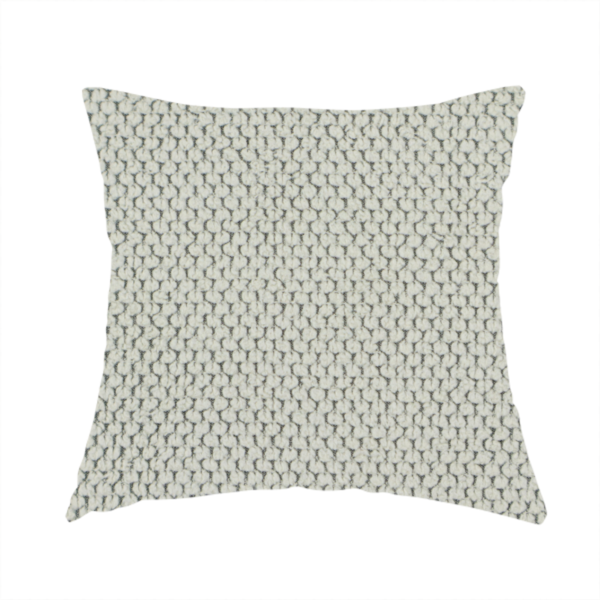The fabric used to create these handmade cushions is a waffle-knit or honeycomb-patterned weave, defined by a uniform, three-dimensional grid of raised, rounded textures. Its classic, versatile ivory hue and matte finish provide an elegant, cosy aesthetic. This structured, high-quality material is an excellent choice for luxury upholstery, decorative cushions, and premium home textiles that require a blend of durability and timeless style.