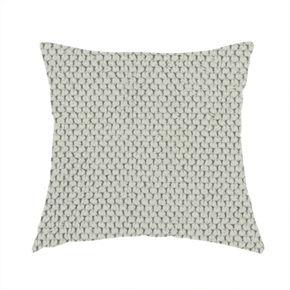 The fabric used to create these handmade cushions is a waffle-knit or honeycomb-patterned weave, defined by a uniform, three-dimensional grid of raised, rounded textures. Its classic, versatile ivory hue and matte finish provide an elegant, cosy aesthetic. This structured, high-quality material is an excellent choice for luxury upholstery, decorative cushions, and premium home textiles that require a blend of durability and timeless style.