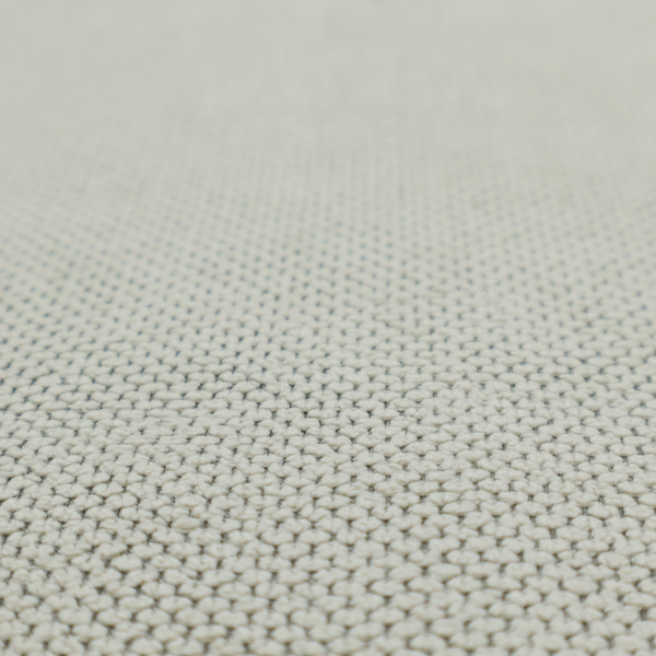 A waffle-knit or honeycomb-patterned weave, defined by a uniform, three-dimensional grid of raised, rounded textures. Its classic, versatile ivory hue and matte finish provide an elegant, cosy aesthetic. This structured, high-quality material is an excellent choice for luxury upholstery, decorative cushions, and premium home textiles that require a blend of durability and timeless style.