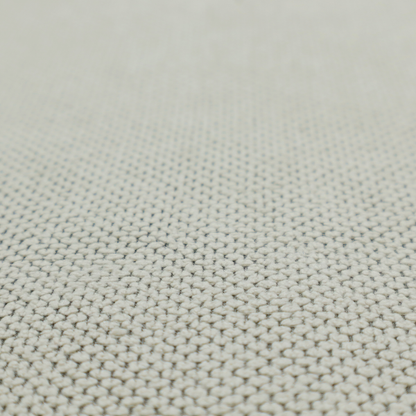 A waffle-knit or honeycomb-patterned weave, defined by a uniform, three-dimensional grid of raised, rounded textures. Its classic, versatile ivory hue and matte finish provide an elegant, cosy aesthetic. This structured, high-quality material is an excellent choice for luxury upholstery, decorative cushions, and premium home textiles that require a blend of durability and timeless style.