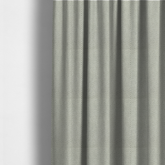 The fabric used to create these made-to-measure curtains is a waffle-knit or honeycomb-patterned weave, defined by a uniform, three-dimensional grid of raised, rounded textures. Its classic, versatile ivory hue and matte finish provide an elegant, cosy aesthetic. This structured, high-quality material is an excellent choice for luxury upholstery, decorative cushions, and premium home textiles that require a blend of durability and timeless style.