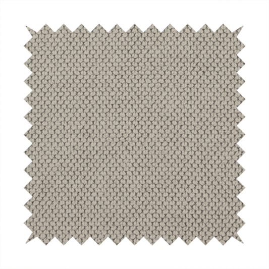A waffle-knit or honeycomb-patterned weave, defined by a uniform, three-dimensional grid of raised, rounded textures. Its warm, versatile beige hue and matte finish provide an elegant, cosy aesthetic. This structured, high-quality material is an excellent choice for luxury upholstery, decorative cushions, and premium home textiles that require a blend of durability and timeless style.
