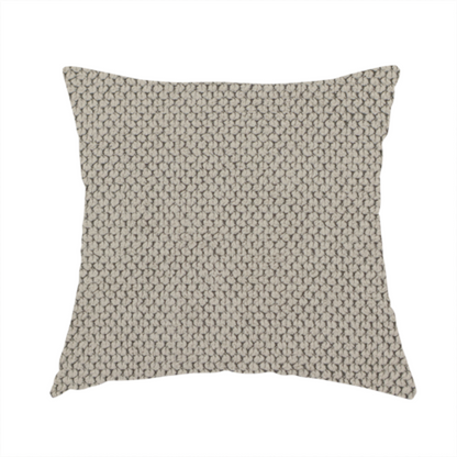 The fabric used to create these handmade cushions is a waffle-knit or honeycomb-patterned weave, defined by a uniform, three-dimensional grid of raised, rounded textures. Its warm, versatile beige hue and matte finish provide an elegant, cosy aesthetic. This structured, high-quality material is an excellent choice for luxury upholstery, decorative cushions, and premium home textiles that require a blend of durability and timeless style.