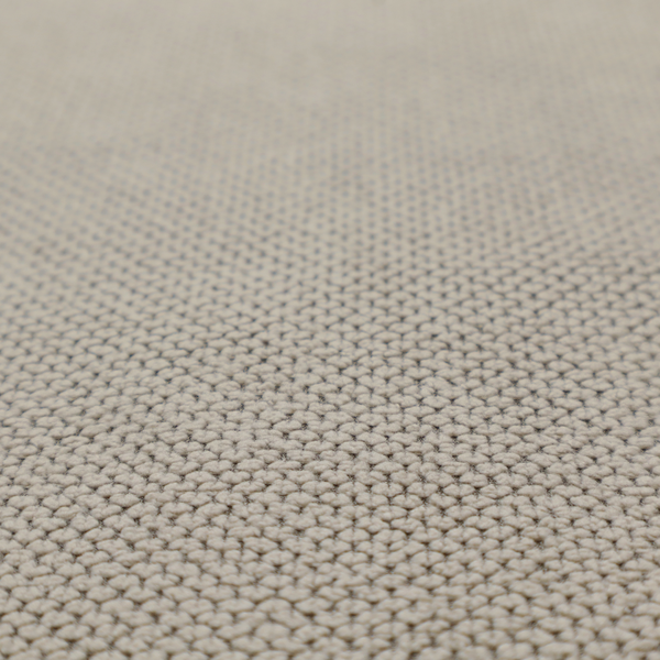 A waffle-knit or honeycomb-patterned weave, defined by a uniform, three-dimensional grid of raised, rounded textures. Its warm, versatile beige hue and matte finish provide an elegant, cosy aesthetic. This structured, high-quality material is an excellent choice for luxury upholstery, decorative cushions, and premium home textiles that require a blend of durability and timeless style.