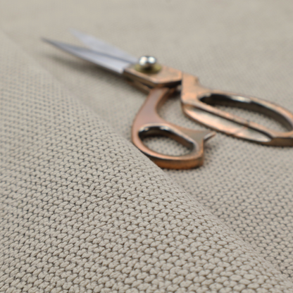 A waffle-knit or honeycomb-patterned weave, defined by a uniform, three-dimensional grid of raised, rounded textures. Its warm, versatile beige hue and matte finish provide an elegant, cosy aesthetic. This structured, high-quality material is an excellent choice for luxury upholstery, decorative cushions, and premium home textiles that require a blend of durability and timeless style.