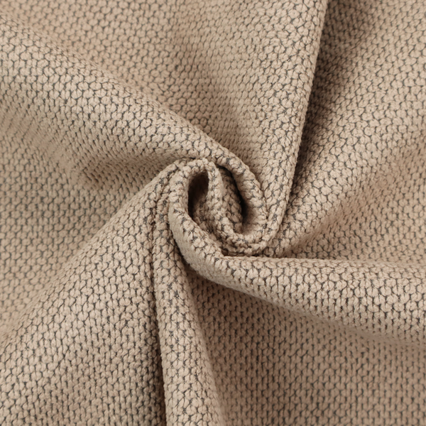 A waffle-knit or honeycomb-patterned weave, defined by a uniform, three-dimensional grid of raised, rounded textures. Its warm, inviting tan or light brown hue and matte finish provide an elegant, cosy aesthetic. This structured, high-quality material is an excellent choice for luxury upholstery, decorative cushions, and premium home textiles that require a blend of durability and timeless style.