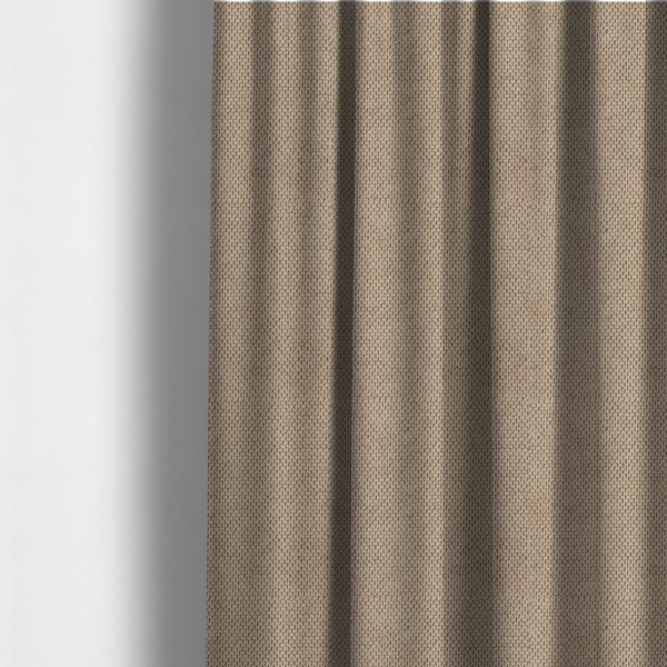 The fabric used to create these made-to-measure curtains is a waffle-knit or honeycomb-patterned weave, defined by a uniform, three-dimensional grid of raised, rounded textures. Its warm, inviting tan or light brown hue and matte finish provide an elegant, cosy aesthetic. This structured, high-quality material is an excellent choice for luxury upholstery, decorative cushions, and premium home textiles that require a blend of durability and timeless style.