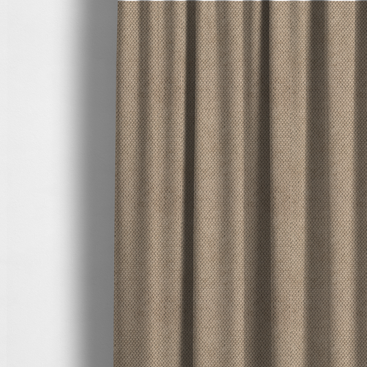 The fabric used to create these made-to-measure curtains is a waffle-knit or honeycomb-patterned weave, defined by a uniform, three-dimensional grid of raised, rounded textures. Its warm, inviting tan or light brown hue and matte finish provide an elegant, cosy aesthetic. This structured, high-quality material is an excellent choice for luxury upholstery, decorative cushions, and premium home textiles that require a blend of durability and timeless style.