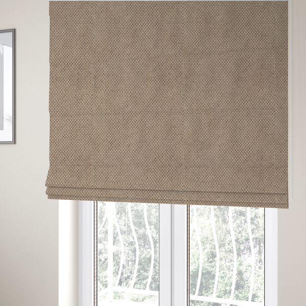 The fabric used to create these Roman blinds is a waffle-knit or honeycomb-patterned weave, defined by a uniform, three-dimensional grid of raised, rounded textures. Its warm, inviting tan or light brown hue and matte finish provide an elegant, cosy aesthetic. This structured, high-quality material is an excellent choice for luxury upholstery, decorative cushions, and premium home textiles that require a blend of durability and timeless style.
