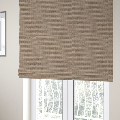 The fabric used to create these Roman blinds is a waffle-knit or honeycomb-patterned weave, defined by a uniform, three-dimensional grid of raised, rounded textures. Its warm, inviting tan or light brown hue and matte finish provide an elegant, cosy aesthetic. This structured, high-quality material is an excellent choice for luxury upholstery, decorative cushions, and premium home textiles that require a blend of durability and timeless style.
