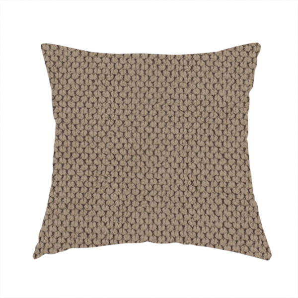 The fabric used to create these handmade cushions is a waffle-knit or honeycomb-patterned weave, defined by a uniform, three-dimensional grid of raised, rounded textures. Its rich, earthy taupe or warm brown hue and matte finish provide an elegant, cosy aesthetic. This structured, high-quality material is an excellent choice for luxury upholstery, decorative cushions, and premium home textiles that require a blend of durability and timeless style.