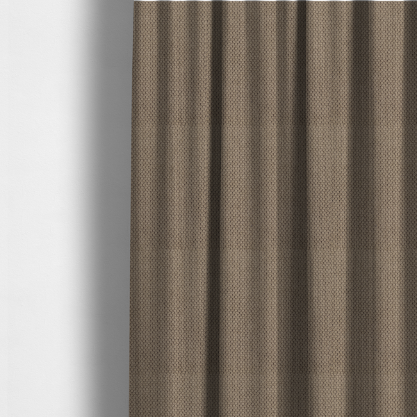 The fabric used to create these made-to-measure curtains is a waffle-knit or honeycomb-patterned weave, defined by a uniform, three-dimensional grid of raised, rounded textures. Its rich, earthy taupe or warm brown hue and matte finish provide an elegant, cosy aesthetic. This structured, high-quality material is an excellent choice for luxury upholstery, decorative cushions, and premium home textiles that require a blend of durability and timeless style.