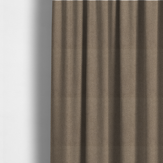 The fabric used to create these made-to-measure curtains is a waffle-knit or honeycomb-patterned weave, defined by a uniform, three-dimensional grid of raised, rounded textures. Its rich, earthy taupe or warm brown hue and matte finish provide an elegant, cosy aesthetic. This structured, high-quality material is an excellent choice for luxury upholstery, decorative cushions, and premium home textiles that require a blend of durability and timeless style.