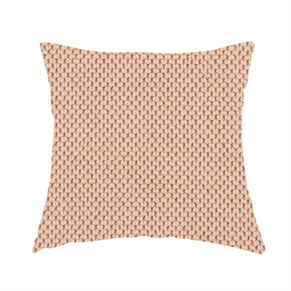 The fabric used to create these handmade cushions is a waffle-knit or honeycomb-patterned weave, defined by a uniform, three-dimensional grid of raised, rounded textures. Its soft, warm peach or dusty rose hue and matte finish provide an elegant, cosy aesthetic. This structured, high-quality material is an excellent choice for luxury upholstery, decorative cushions, and premium home textiles that require a blend of durability and timeless style.