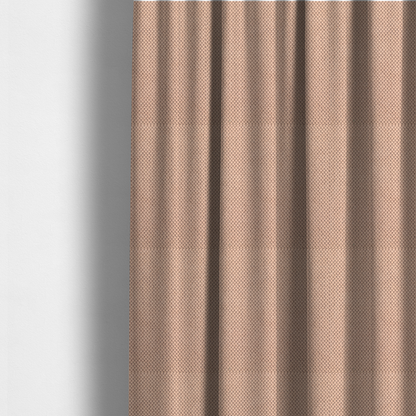 The fabric used to create these made-to-measure curtains is a waffle-knit or honeycomb-patterned weave, defined by a uniform, three-dimensional grid of raised, rounded textures. Its soft, warm peach or dusty rose hue and matte finish provide an elegant, cosy aesthetic. This structured, high-quality material is an excellent choice for luxury upholstery, decorative cushions, and premium home textiles that require a blend of durability and timeless style.