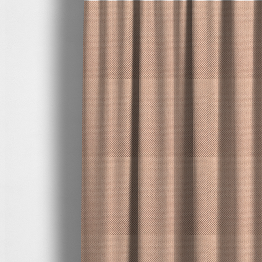 The fabric used to create these made-to-measure curtains is a waffle-knit or honeycomb-patterned weave, defined by a uniform, three-dimensional grid of raised, rounded textures. Its soft, warm peach or dusty rose hue and matte finish provide an elegant, cosy aesthetic. This structured, high-quality material is an excellent choice for luxury upholstery, decorative cushions, and premium home textiles that require a blend of durability and timeless style.