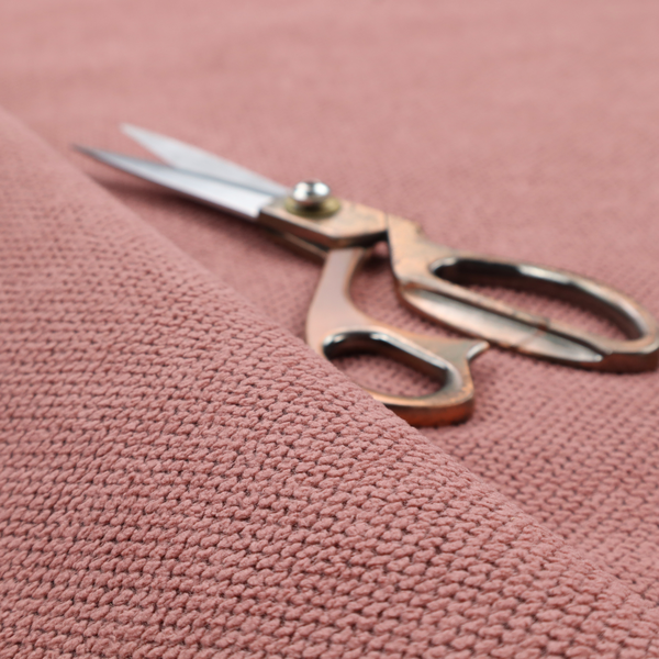 A waffle-knit or honeycomb-patterned weave, defined by a uniform, three-dimensional grid of raised, rounded textures. Its rich, warm dusty rose or muted mauve hue and matte finish provide an elegant, cosy aesthetic. This structured, high-quality material is an excellent choice for luxury upholstery, decorative cushions, and premium home textiles that require a blend of durability and timeless style.