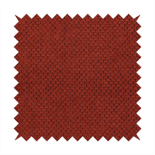 A waffle-knit or honeycomb-patterned weave, defined by a uniform, three-dimensional grid of raised, rounded textures. Its bold, warm terracotta or rust hue and matte finish provide a striking, cosy aesthetic. This structured, high-quality material is an excellent choice for statement upholstery, decorative accent cushions, or premium home textiles that require a blend of durability and timeless, earthy style.