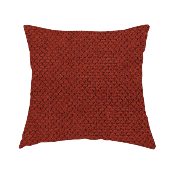 The fabric used to create these handmade cushions is a waffle-knit or honeycomb-patterned weave, defined by a uniform, three-dimensional grid of raised, rounded textures. Its bold, warm terracotta or rust hue and matte finish provide a striking, cosy aesthetic. This structured, high-quality material is an excellent choice for statement upholstery, decorative accent cushions, or premium home textiles that require a blend of durability and timeless, earthy style.