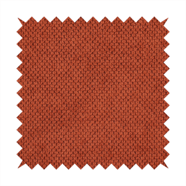 A waffle-knit or honeycomb-patterned weave, defined by a uniform, three-dimensional grid of raised, rounded textures. Its warm, vibrant burnt orange or deep copper hue and matte finish provide a striking, cosy aesthetic. This structured, high-quality material is an excellent choice for statement upholstery, decorative accent cushions, or premium home textiles that require a blend of durability and timeless, rich style.