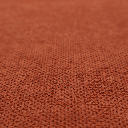 A waffle-knit or honeycomb-patterned weave, defined by a uniform, three-dimensional grid of raised, rounded textures. Its warm, vibrant burnt orange or deep copper hue and matte finish provide a striking, cosy aesthetic. This structured, high-quality material is an excellent choice for statement upholstery, decorative accent cushions, or premium home textiles that require a blend of durability and timeless, rich style.