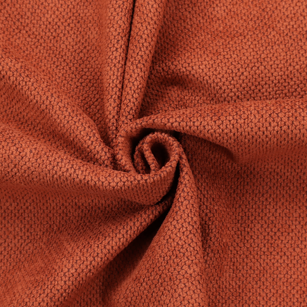 A waffle-knit or honeycomb-patterned weave, defined by a uniform, three-dimensional grid of raised, rounded textures. Its warm, vibrant burnt orange or deep copper hue and matte finish provide a striking, cosy aesthetic. This structured, high-quality material is an excellent choice for statement upholstery, decorative accent cushions, or premium home textiles that require a blend of durability and timeless, rich style.