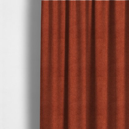 The fabric used to create these made-to-measure curtains is a waffle-knit or honeycomb-patterned weave, defined by a uniform, three-dimensional grid of raised, rounded textures. Its warm, vibrant burnt orange or deep copper hue and matte finish provide a striking, cosy aesthetic. This structured, high-quality material is an excellent choice for statement upholstery, decorative accent cushions, or premium home textiles that require a blend of durability and timeless, rich style.