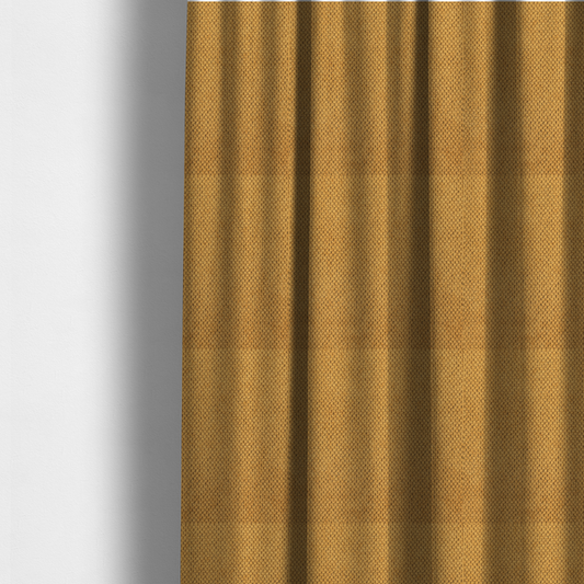 The fabric used to create these made-to-measure curtains is a waffle-knit or honeycomb-patterned weave of the collection, defined by its uniform, three-dimensional grid of raised, rounded textures. Its warm, vibrant mustard yellow or golden ochre hue, paired with a matte finish, provides a rich, inviting aesthetic. This structured, high-quality material is an excellent choice for statement upholstery, decorative accent cushions, or premium home textiles that require a blend of durability and timeless, cheer