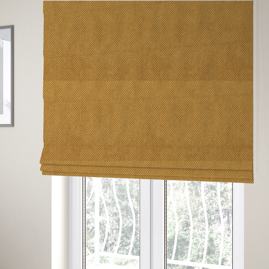The fabric used to create these Roman blinds is a waffle-knit or honeycomb-patterned weave of the collection, defined by its uniform, three-dimensional grid of raised, rounded textures. Its warm, vibrant mustard yellow or golden ochre hue, paired with a matte finish, provides a rich, inviting aesthetic. This structured, high-quality material is an excellent choice for statement upholstery, decorative accent cushions, or premium home textiles that require a blend of durability and timeless, cheerful style.
