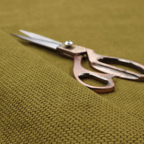 A waffle-knit or honeycomb-patterned weave of the collection, characterized by a uniform, three-dimensional grid of raised, rounded textures. Its rich, organic olive green or mossy tone with a matte finish offers a sophisticated, earthy aesthetic. This structured, high-quality material is an excellent choice for creating grounded, nature-inspired upholstery, decorative cushions, or premium home textiles that blend durability with a timeless, tranquil style.