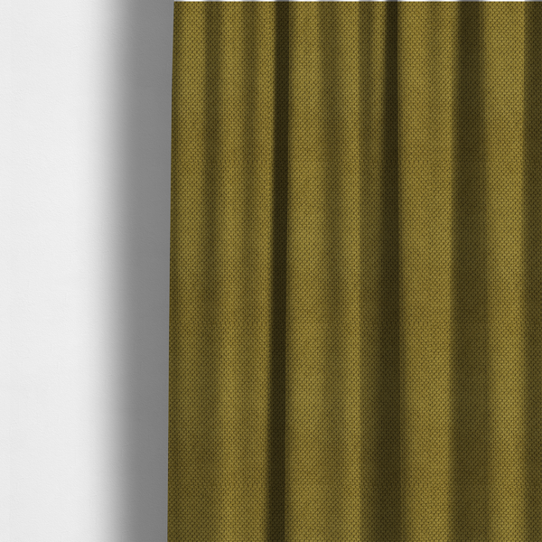 The fabric used to create these made-to-measure curtains is a waffle-knit or honeycomb-patterned weave of the collection, characterized by a uniform, three-dimensional grid of raised, rounded textures. Its rich, organic olive green or mossy tone with a matte finish offers a sophisticated, earthy aesthetic. 