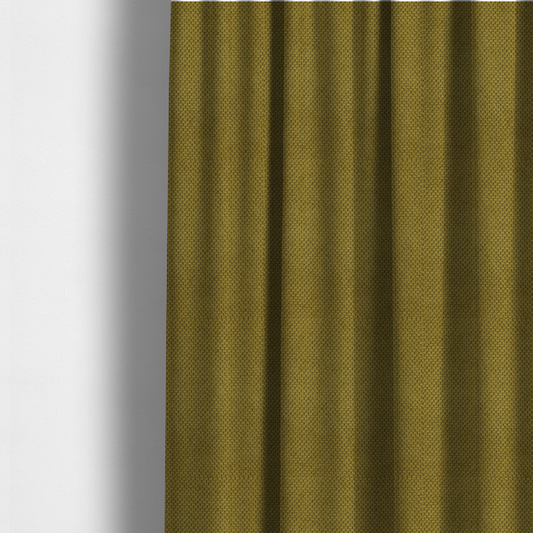 The fabric used to create these made-to-measure curtains is a waffle-knit or honeycomb-patterned weave of the collection, characterized by a uniform, three-dimensional grid of raised, rounded textures. Its rich, organic olive green or mossy tone with a matte finish offers a sophisticated, earthy aesthetic. 