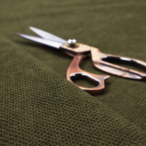 A waffle-knit or honeycomb-patterned weave of the collection, defined by its uniform, three-dimensional grid of raised, rounded textures. Its deep, rich forest green or dark olive hue and matte finish provide a sophisticated, moody, and grounded aesthetic. This structured, high-quality material is an excellent choice for statement-making upholstery, plush decorative cushions, or premium home textiles that require a blend of durability, luxurious depth, and a timeless, nature-inspired style.