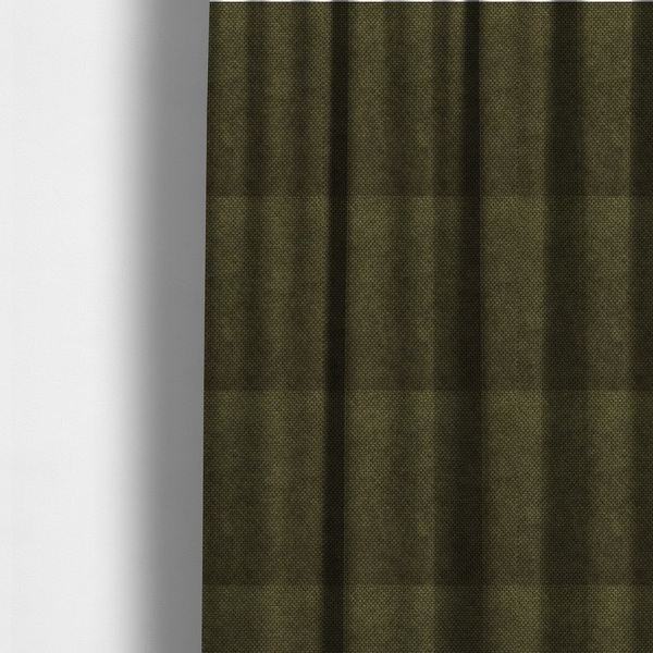 The fabric used to create these made-to-measure curtains is a waffle-knit or honeycomb-patterned weave of the collection, defined by its uniform, three-dimensional grid of raised, rounded textures. Its deep, rich forest green or dark olive hue and matte finish provide a sophisticated, moody, and grounded aesthetic. 
