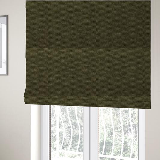The fabric used to create these Roman blinds is a waffle-knit or honeycomb-patterned weave of the collection, defined by its uniform, three-dimensional grid of raised, rounded textures. Its deep, rich forest green or dark olive hue and matte finish provide a sophisticated, moody, and grounded aesthetic.