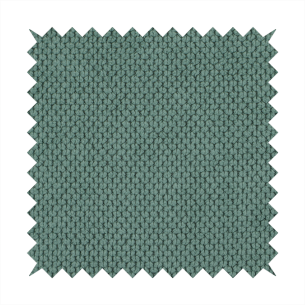 A premium teal or seafoam green fabric with a structured, three-dimensional waffle-knit or honeycomb texture for elegant interior design.