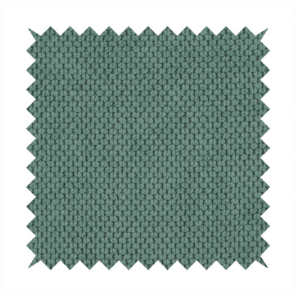 A premium teal or seafoam green fabric with a structured, three-dimensional waffle-knit or honeycomb texture for elegant interior design.
